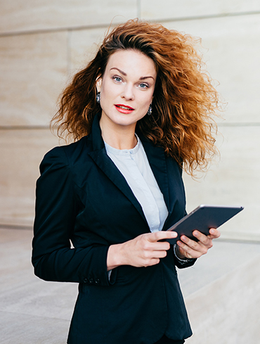 beautiful-businesswoman-with-curly-fluffy-hair-wea-BP2LMPD